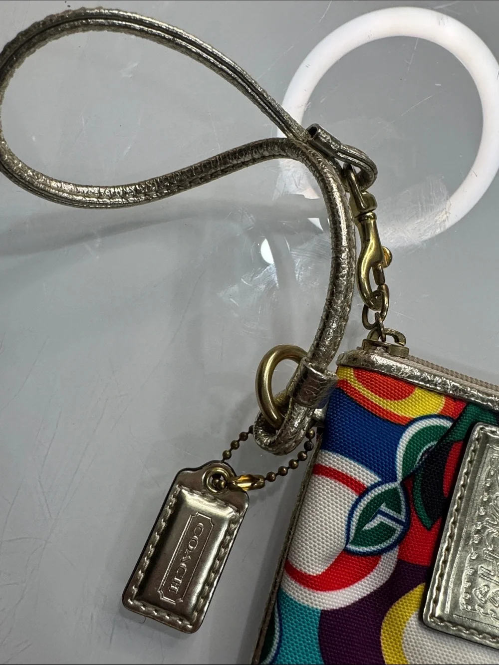 Coach Poppy Multicolor signature wristlet with gold accents and hangtag